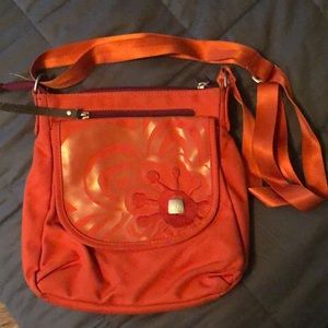 Orange Haiku crossbody bag. Perfect for travel!